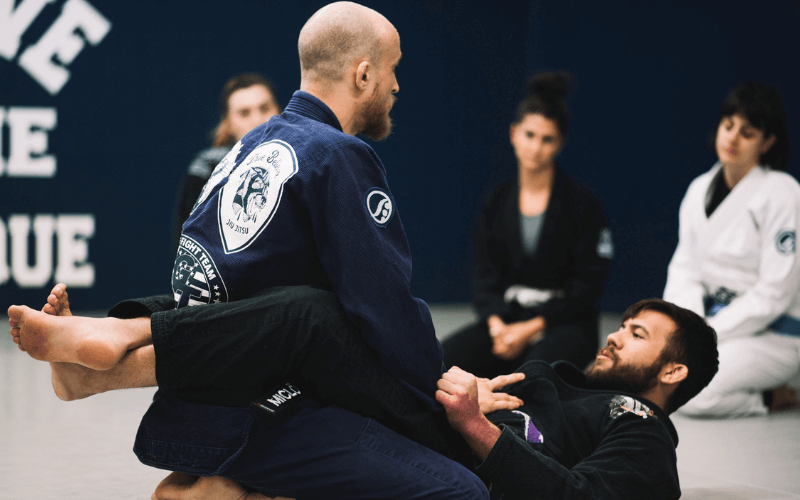 Coach Jake Miclot teaching technique at True Believer Jiu-Jitsu